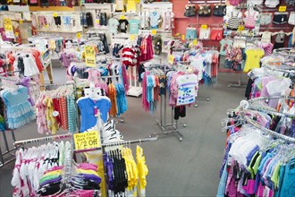 Children's clothing on racks in store