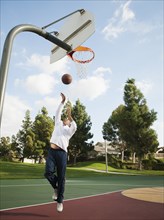 Black man playing basketball