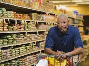 African American man smiling in grocery store