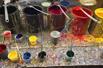 Buckets of paint in studio