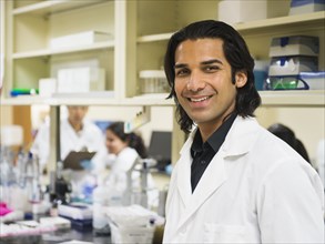 Scientist smiling in laboratory