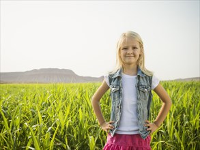 Caucasian girl smiling in corn field
