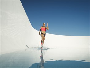 Caucasian woman running on water surface