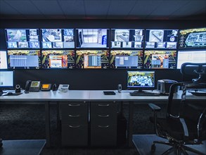 Monitors and empty desk in control room