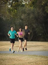 Chinese friends jogging in park
