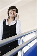 Hispanic businesswoman talking on cell phone