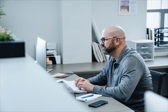 Caucasian businessman using computer
