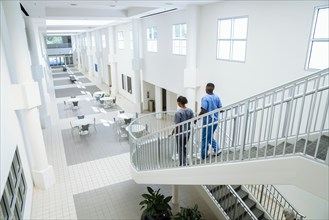 Nurses descending staircase