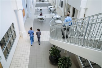Doctor and nurses walking in lobby