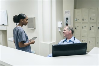 Doctor and nurse talking