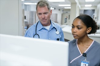 Doctor and nurse using computer