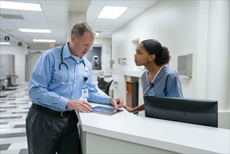 Doctor and nurse using digital tablet
