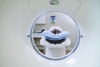 Caucasian patient laying on scanner table