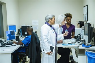 Doctors and nurses using computers