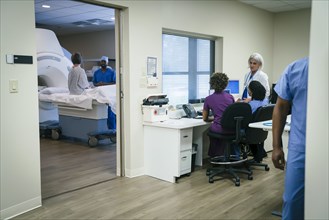 Doctors and nurses near scanner
