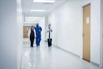 Doctors and nurse walking in hospital
