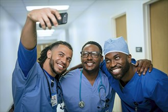 Smiling nurses posing for cell phone selfie