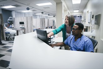 Doctor and nurse using computer