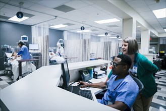 Doctor and nurse using computer in hospital