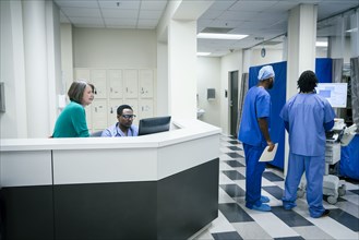 Doctors and nurses using computers in hospital