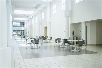 Tables and chairs in empty lobby