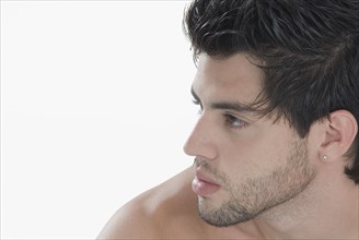 Profile of Hispanic man with bare shoulders