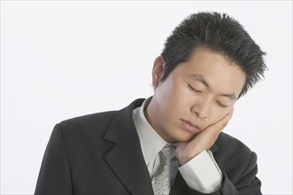 Asian businessman sleeping