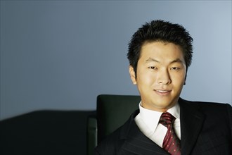 Young Asian businessman smiling