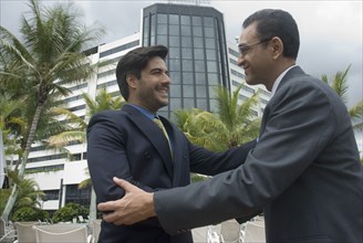 Hispanic businessmen shaking hands