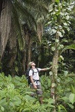 Hispanic man exploring jungle