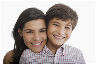 Smiling Hispanic brother and sister