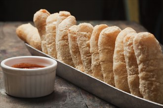 Bread in basket and dipping sauce