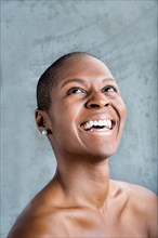 Portrait of smiling Black woman looking up
