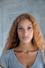 Portrait of serious Mixed Race woman