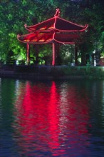 Colorful Vietnamese pagoda near water