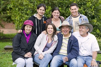 Hispanic family sitting together