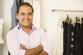 Hispanic man working in clothing store