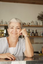 Smiling Hispanic woman in cafe