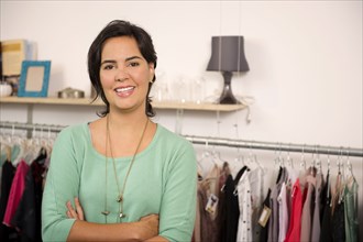 Hispanic woman smiling in shop