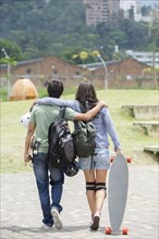 Hispanic couple walking outdoors