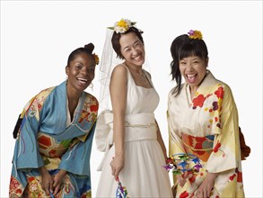 Asian bride with bridesmaids in traditional clothing