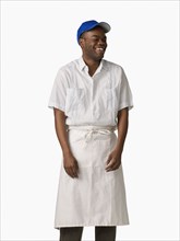 African man wearing cook's uniform