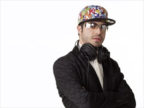 DJ in headphones with arms crossed