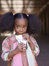 African girl drinking juice