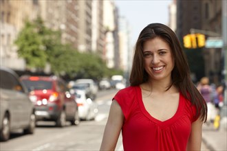 Caucasian woman standing on city street