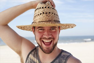 Caucasian man smiling on beach