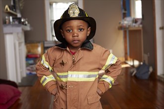 Black boy wearing firefighter Halloween costume