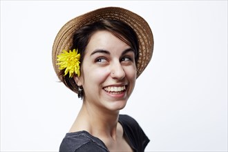 Close up of woman wearing straw hat