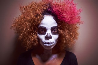 Black woman wearing skull makeup
