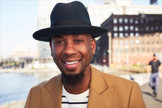 African American man smiling at waterfront